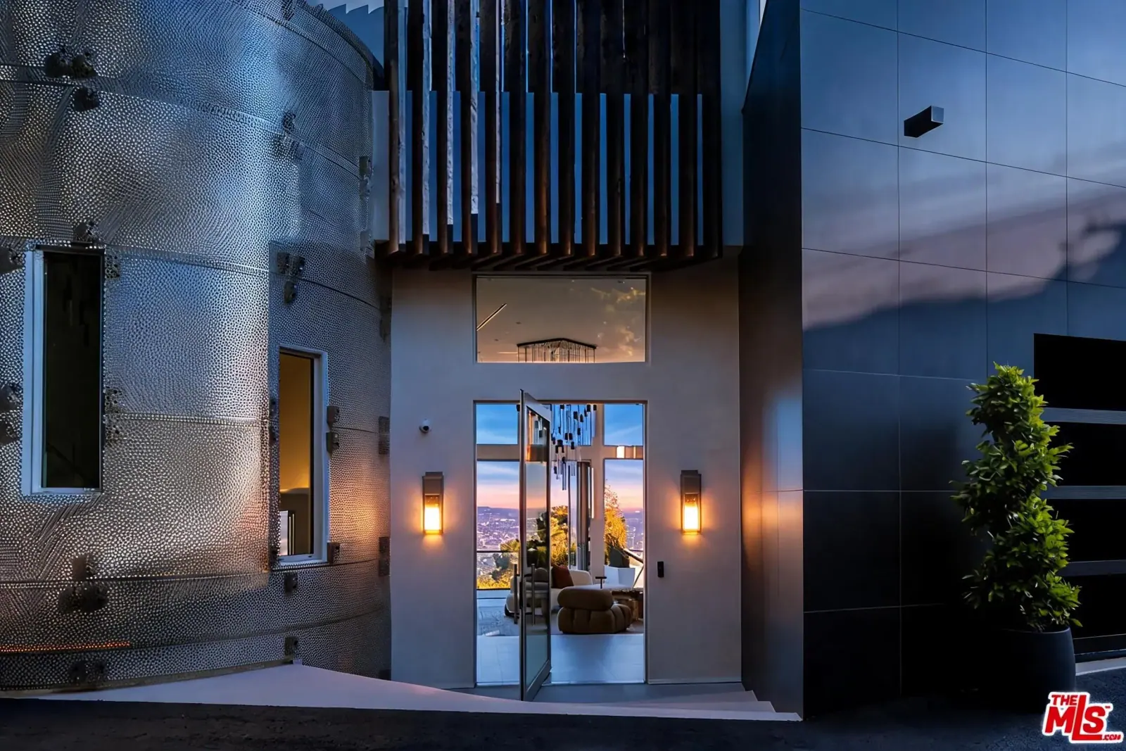 9270 Kinglet Dr entrance with perforated metal facade and open glass pivot door