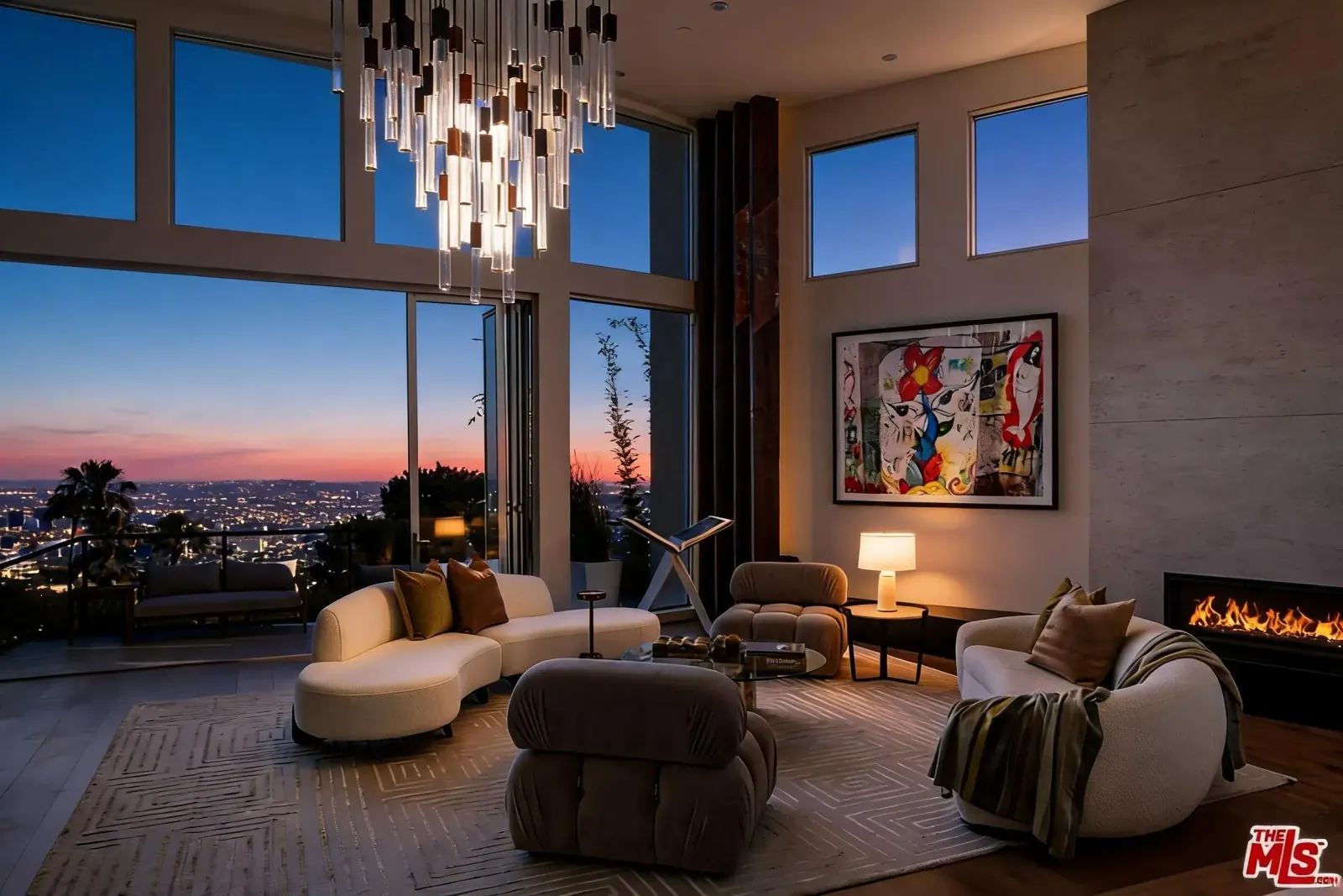 Great room with stone fireplace and Los Angeles view